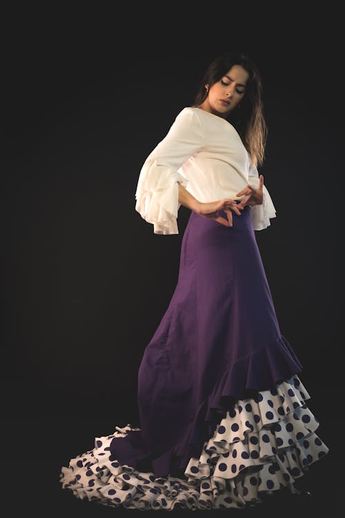 Free Woman in White Long Sleeve Shirt and Purple Skirt Stock Photo