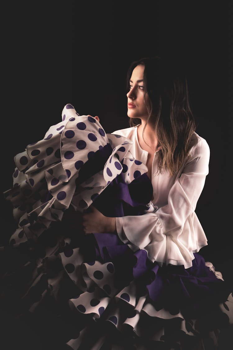 Woman In White Long Sleeve And Ruffle Skirt