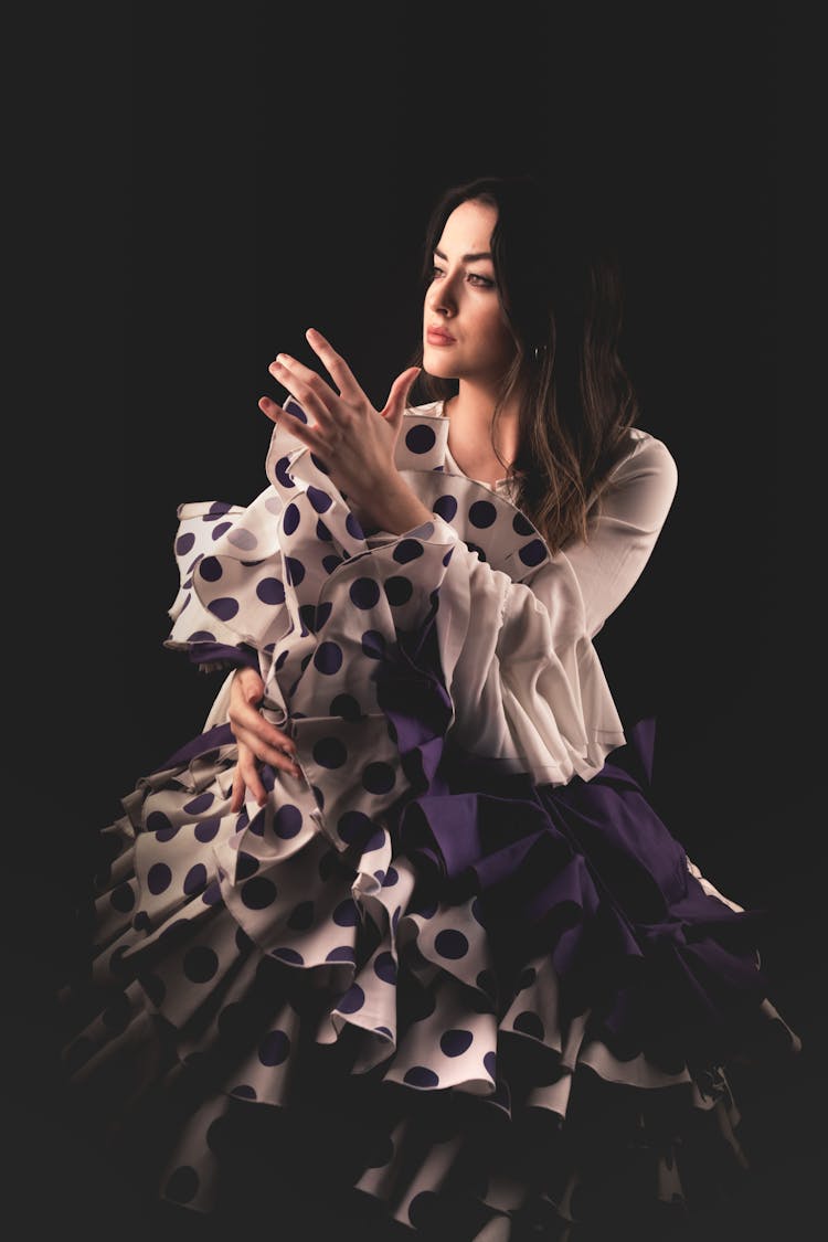 A Beautiful Woman In Ruffle Skirt Dancing