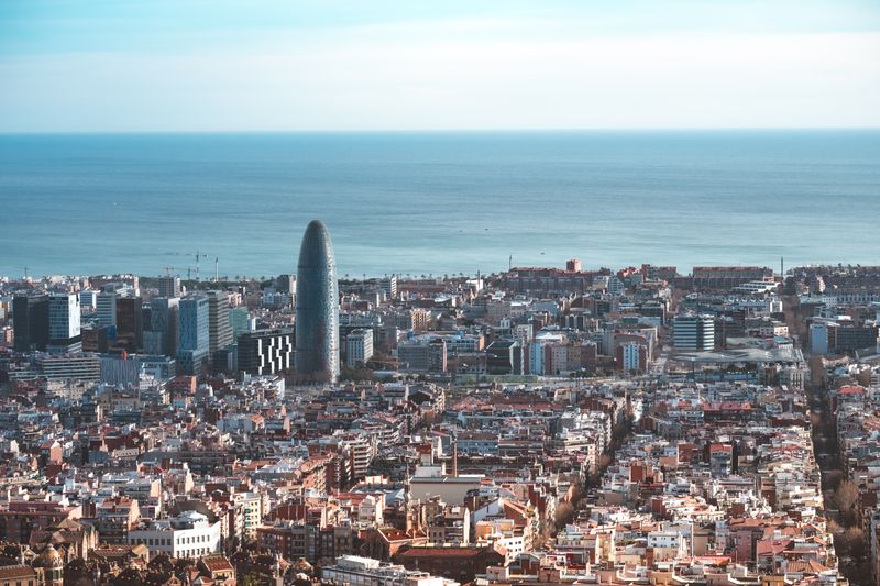 Barcelona skyline with Torre Glòries and the Mediterranean