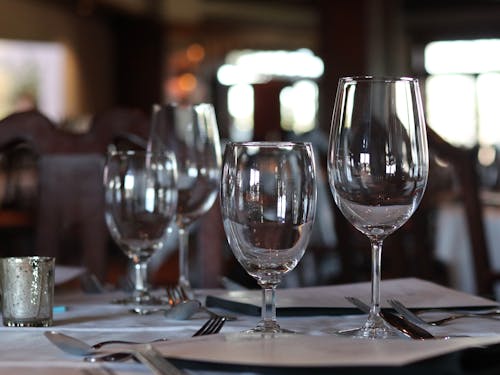 Selective Focus Photo of a Wine Glasses on a Table