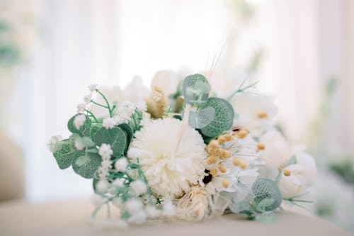 Bouquet of decorative flowers placed on table