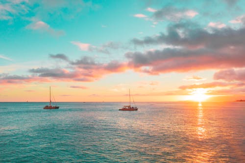 Sailboats on Sea Under Blue Sky during Sunset