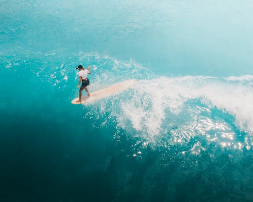 Photo of a Woman on a Surfboard