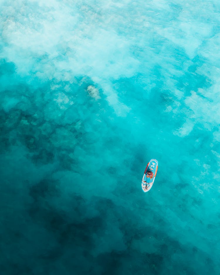 Aerial View On Person On Paddleboard 