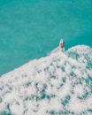 Surfer Creating Waves on Water Surface