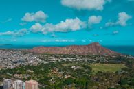 Green and Brown Mountains Under Blue Sky and White Clouds