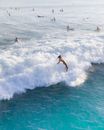 Surfers Surfing on Wave
