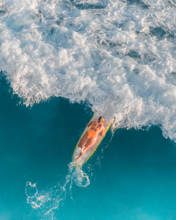 Woman On Water Board On Sea