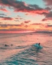 Tourists Surfing at Sunset 