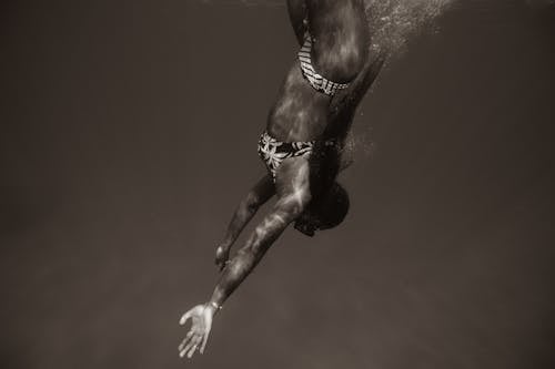 Free Black and White Photo of a Woman Diving Stock Photo