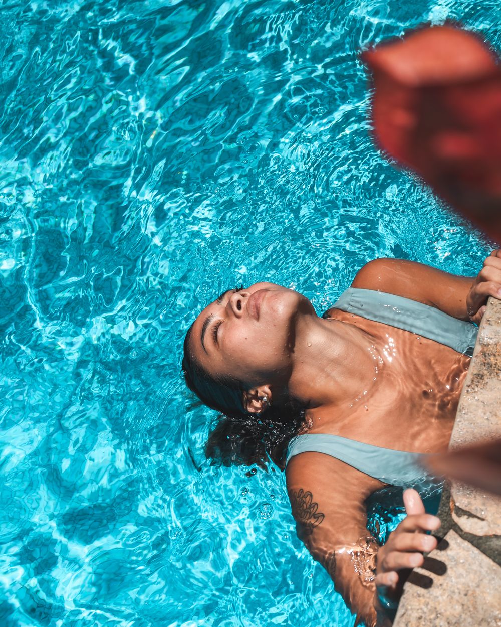Quiet poolside from above — your weekend waiting