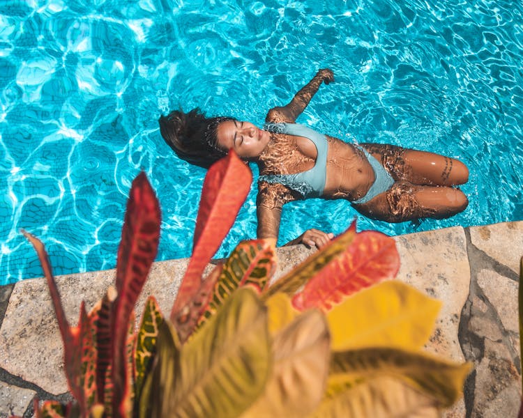 Overhead Shot Of A Woman Swimming In A Pool