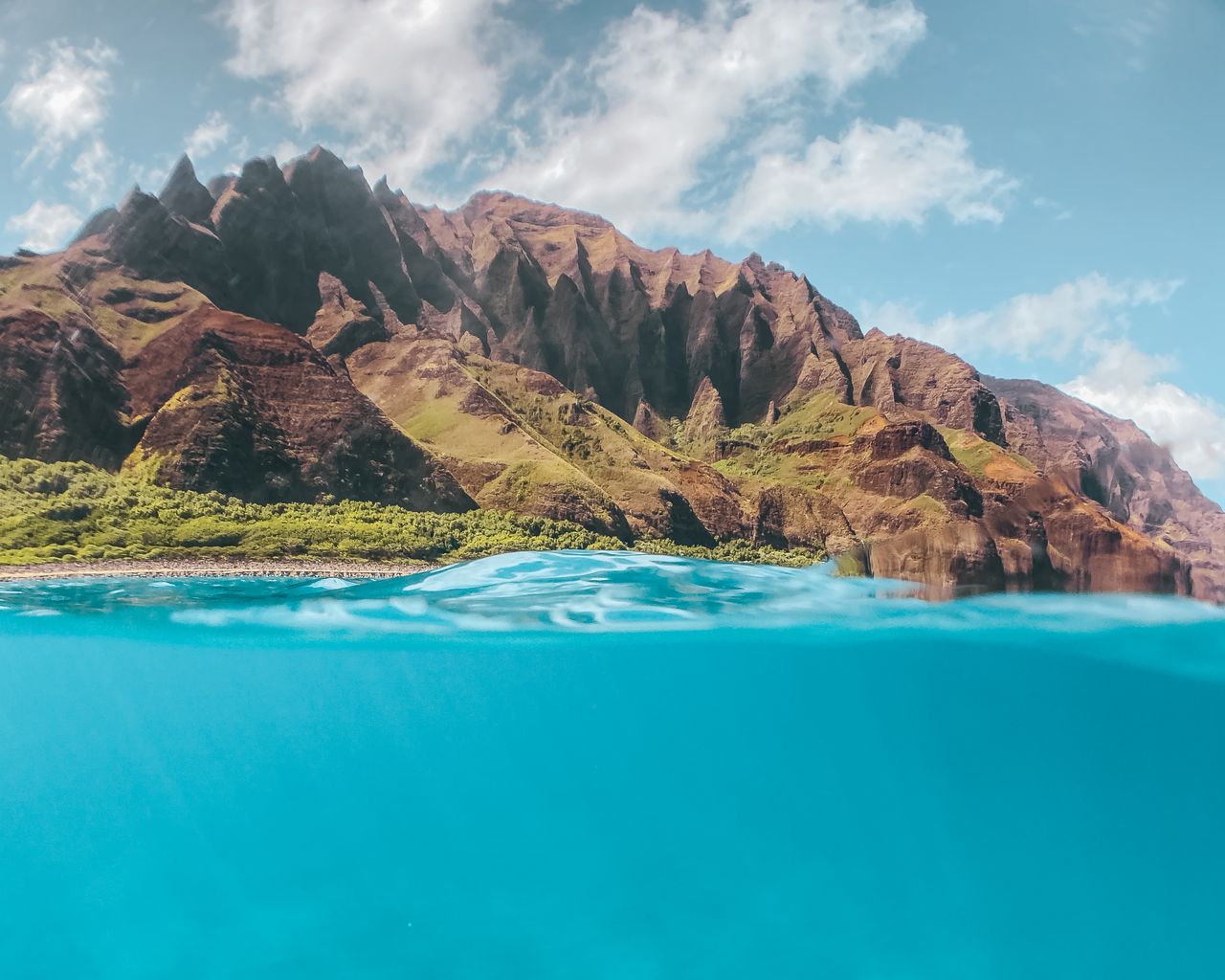 a breathtaking view of hawaii s na pali coast with vibrant blue ocean