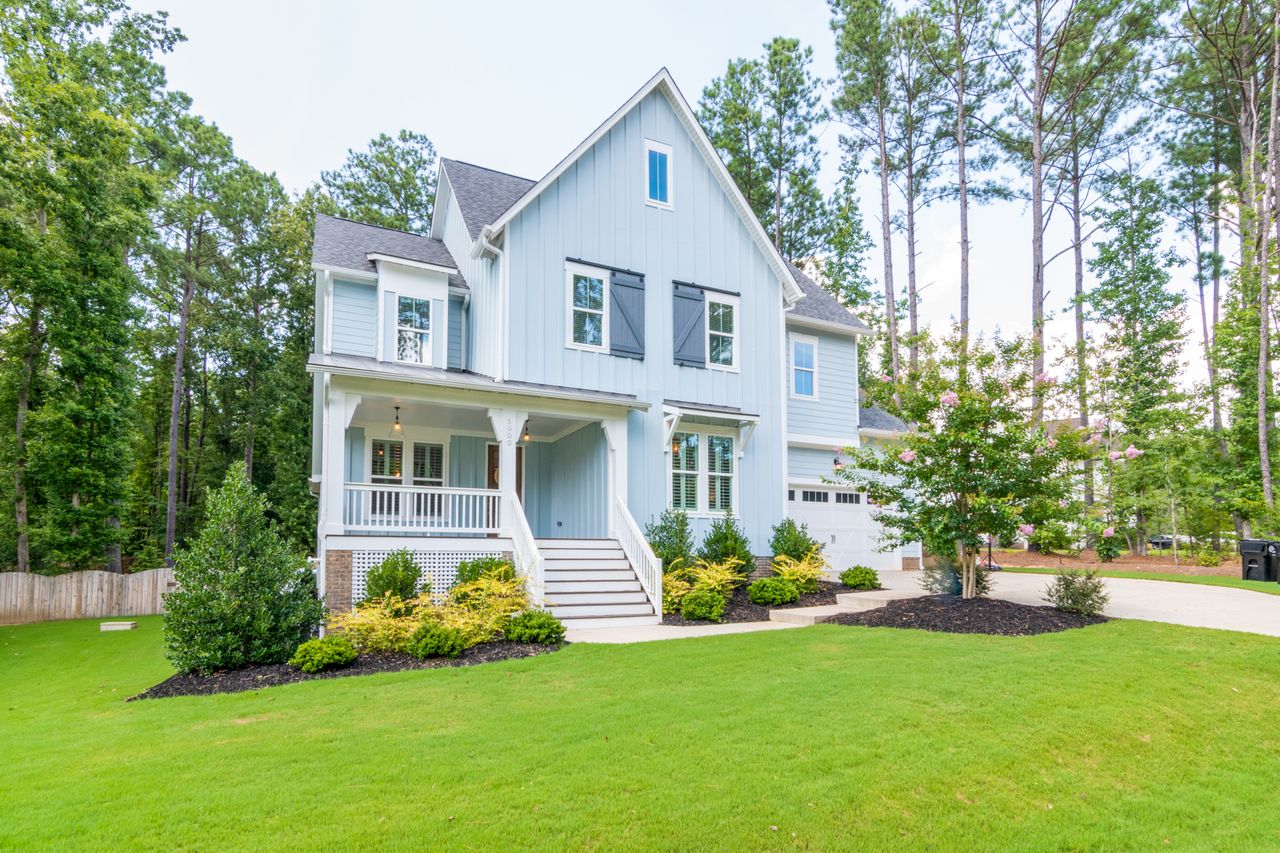 Lush green front lawn of a suburban home in Lancaster New York in spring