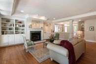 White Leather Couch on Brown Wooden Parquet Flooring