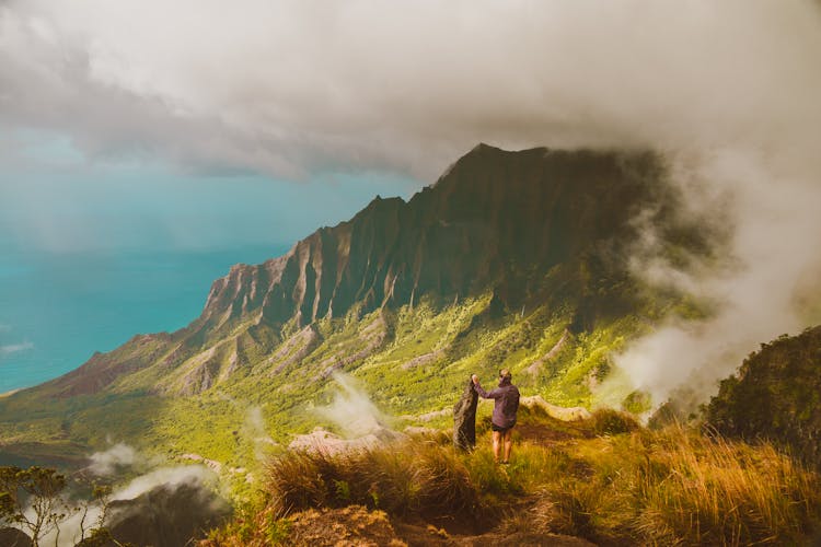 Hikers Standing On Trail Overlooking Scenic Valley