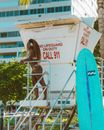 Woman Standing on a Lifeguard Tower