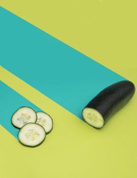 Bright, artistic representation of cucumber slices with vibrant green and blue backdrop, perfect for food and lifestyle concepts.