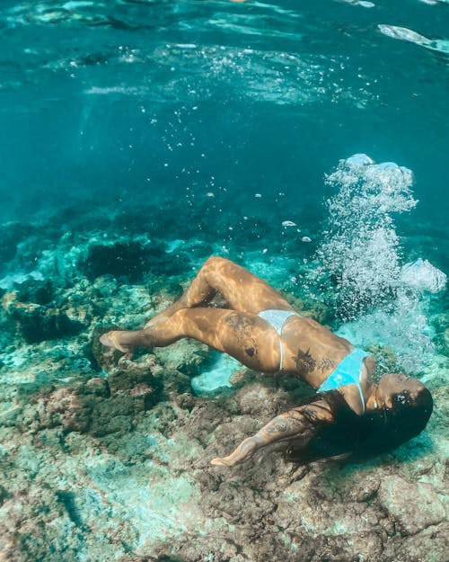 Woman in Blue Bikini Bottom in Water