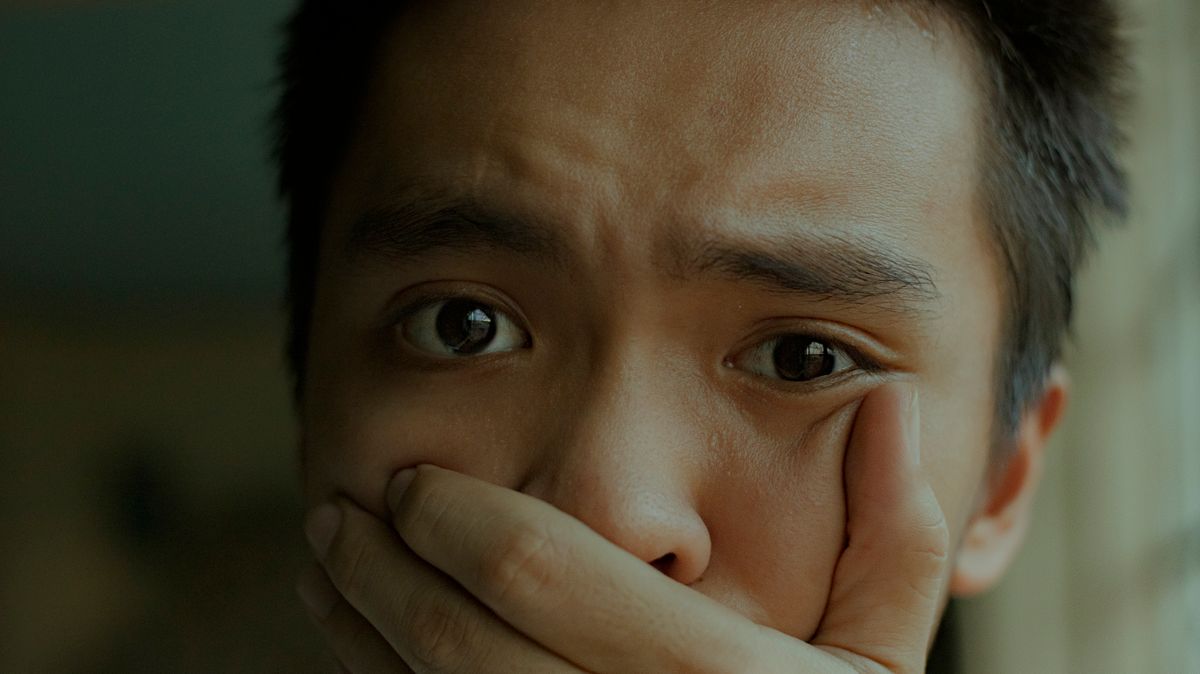 Why You Can't Smell Your Own Breath (And How to Finally Know for Sure) 2 Close-up of a person considering how to check their breath for a bad smell