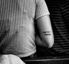 Close-up of Person with Tattoo on Arm