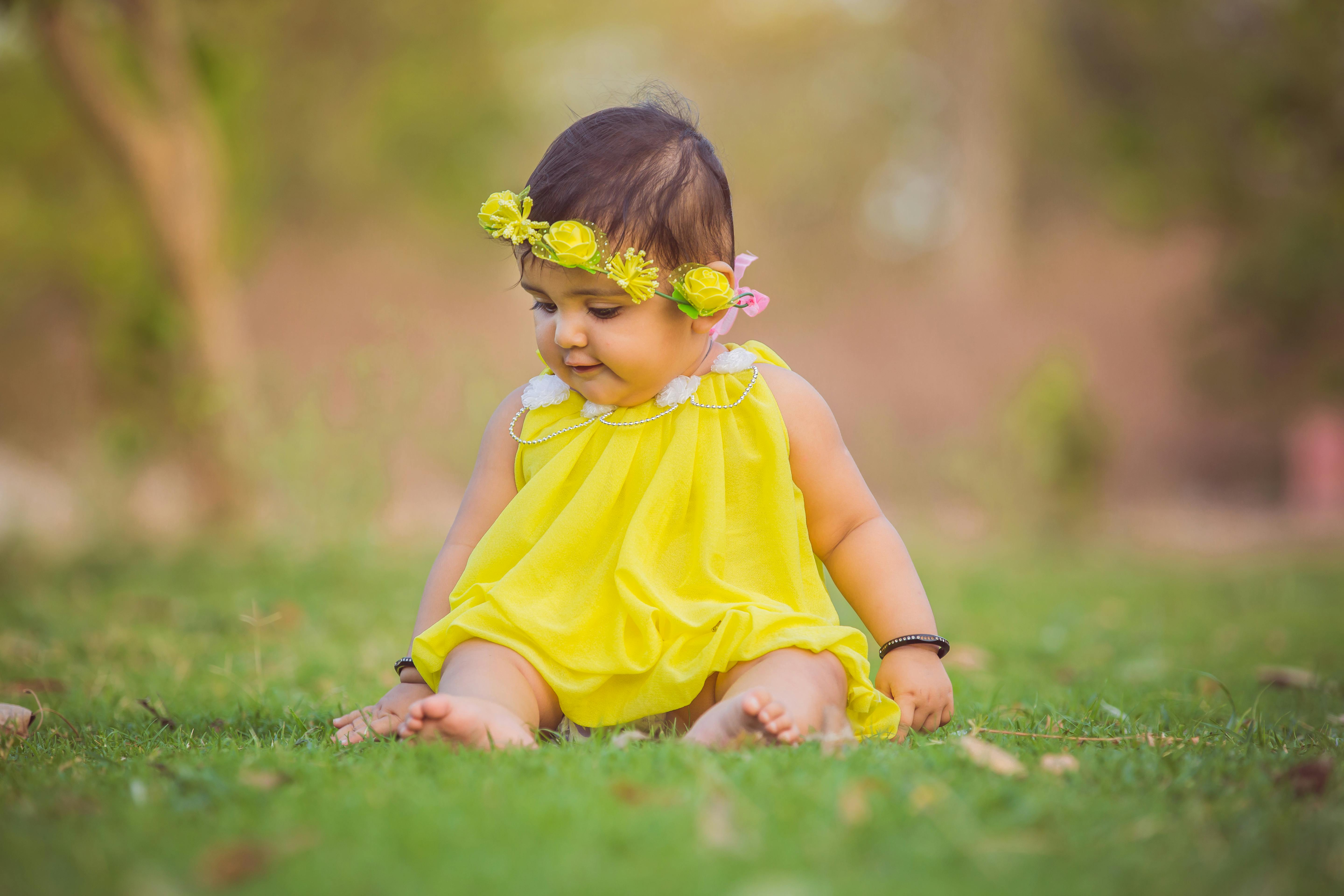 cute baby girl in yellow dress