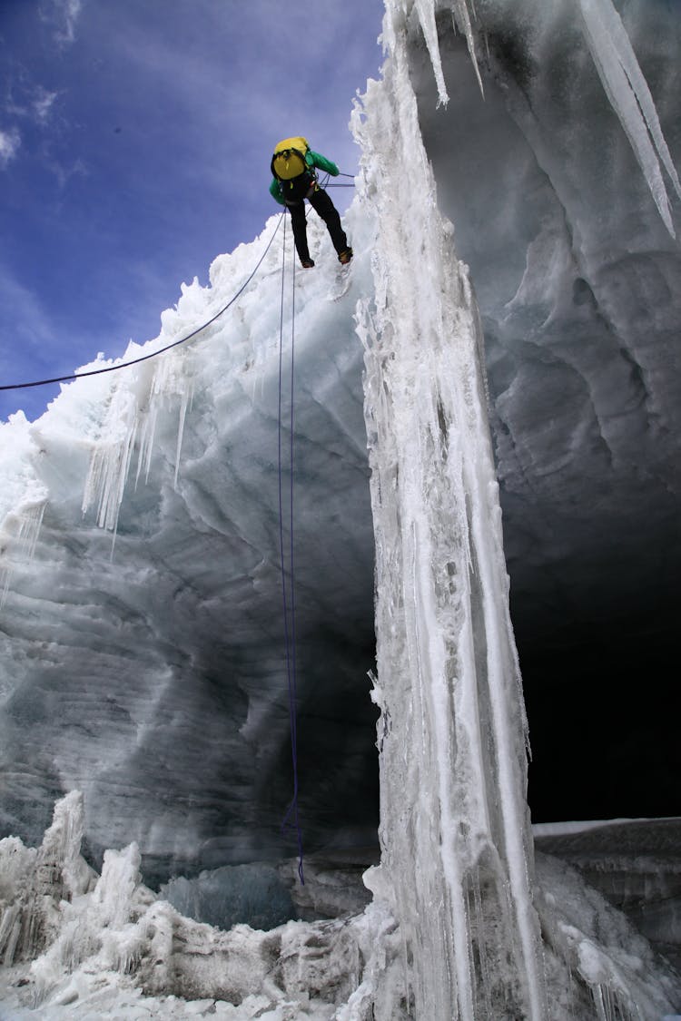 Low Angle View Of A Man Climbing On Ice