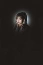 Ethnic woman with dyed hair in light