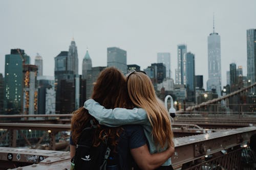 Free A Couple Enjoying the View of the new York City Skyline Stock Photo