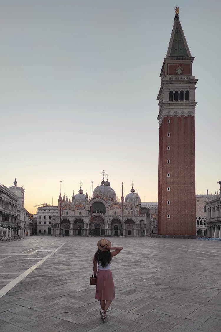 Woman Standing At St. Mark's Square
