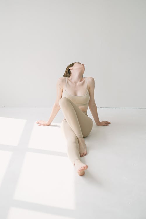 Woman sitting on floor in photo studio