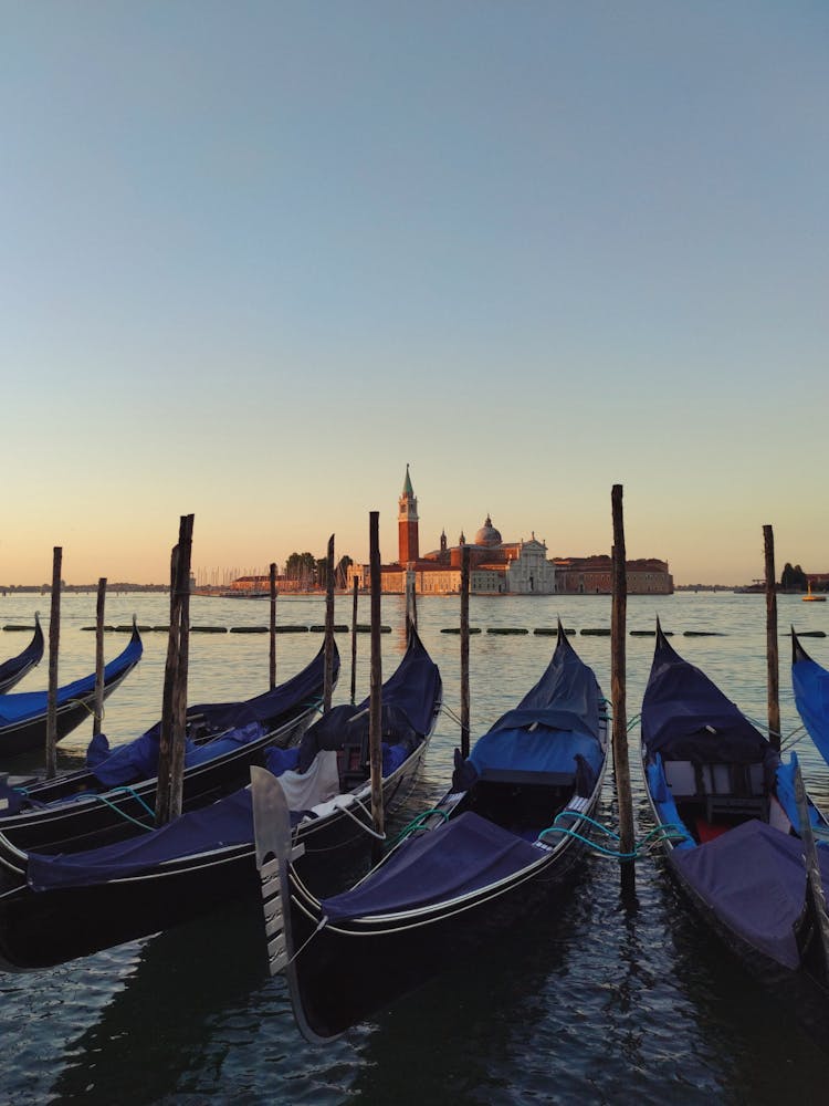 Gondolas Across The San Giorgio Maggiore Church In Venice, Italy