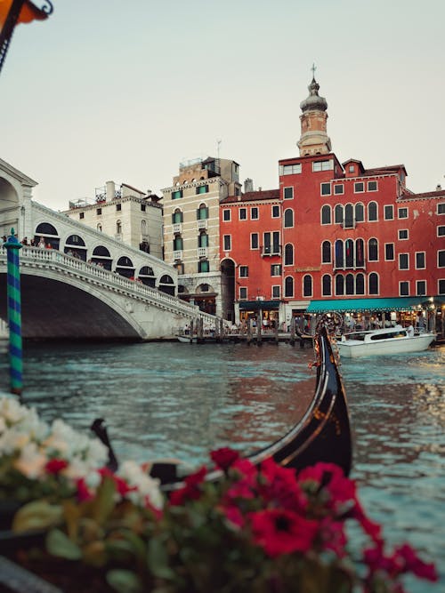 Photo of The Rialto Bridge across the Grand Canal with a Dock 