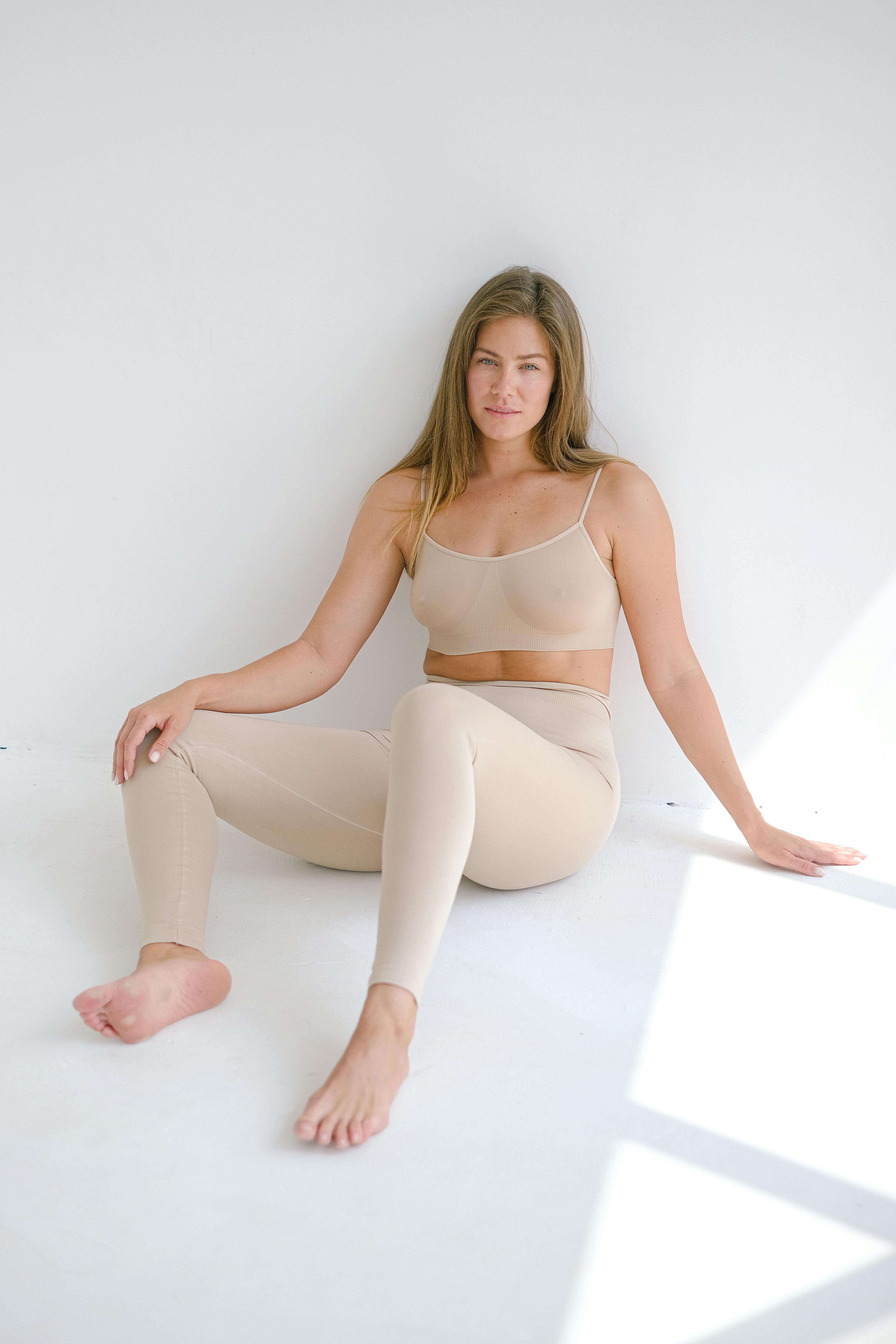 relaxed woman sitting near wall