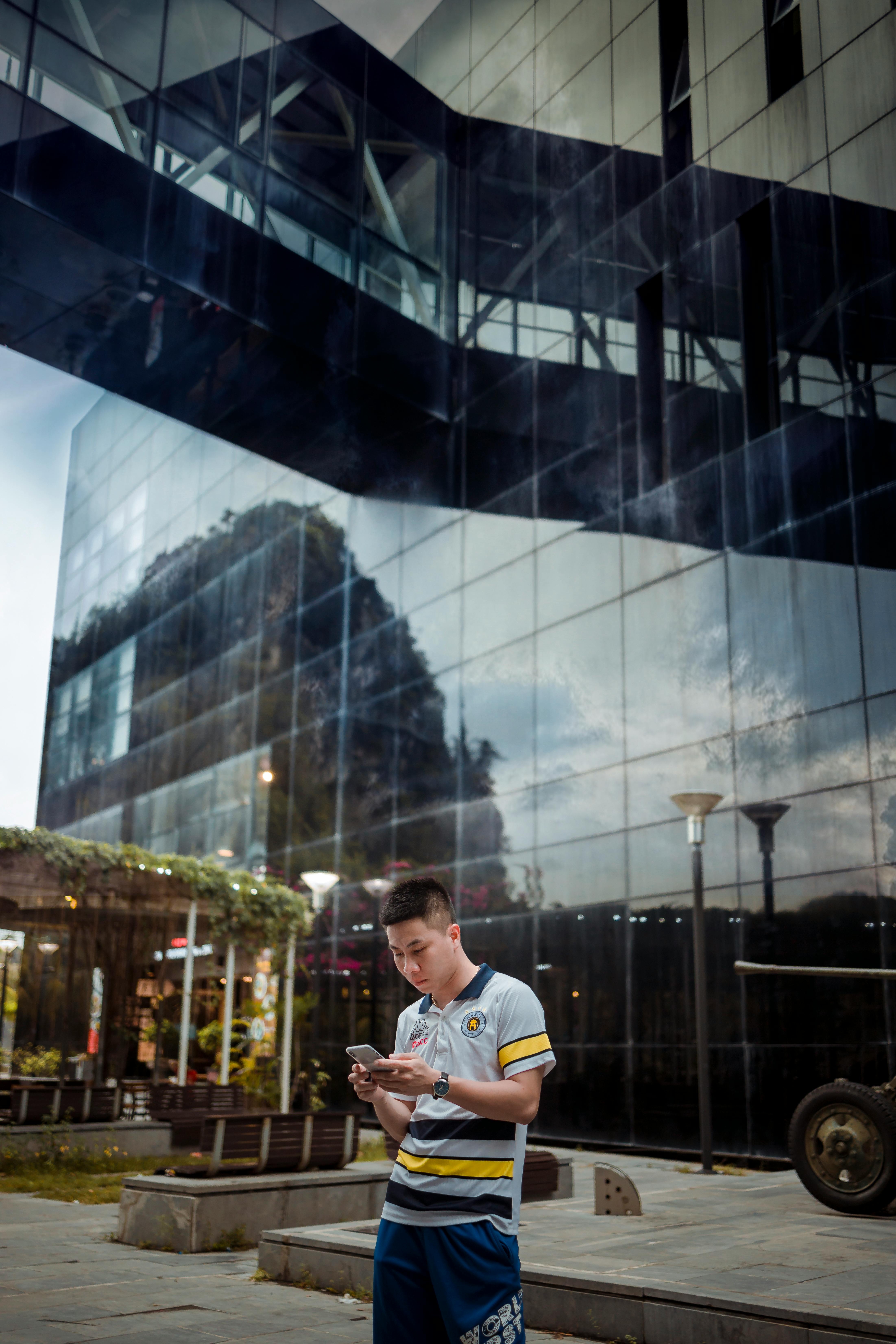 concentrated man using smartphone in street