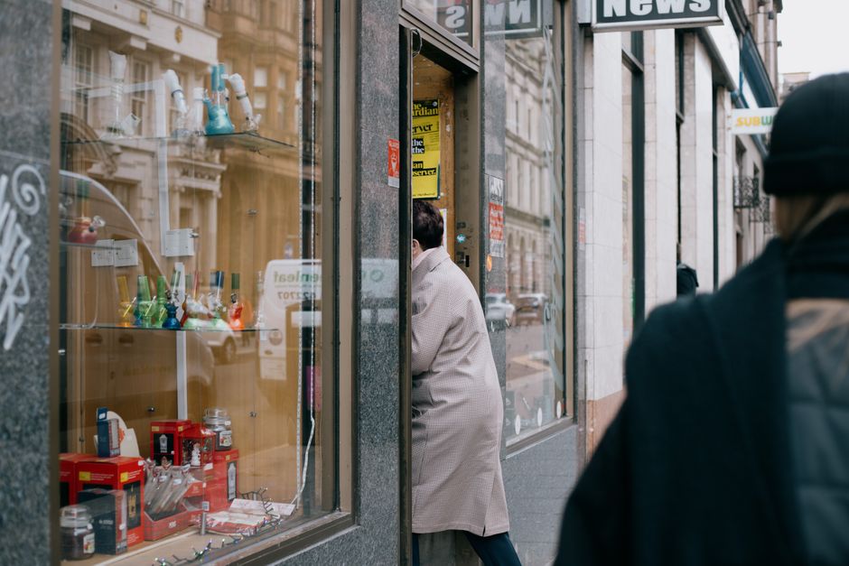 worker entering store dawn