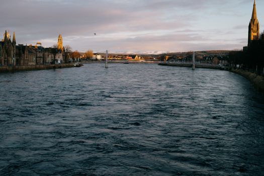 Body of Water Near Bridge and Buildings