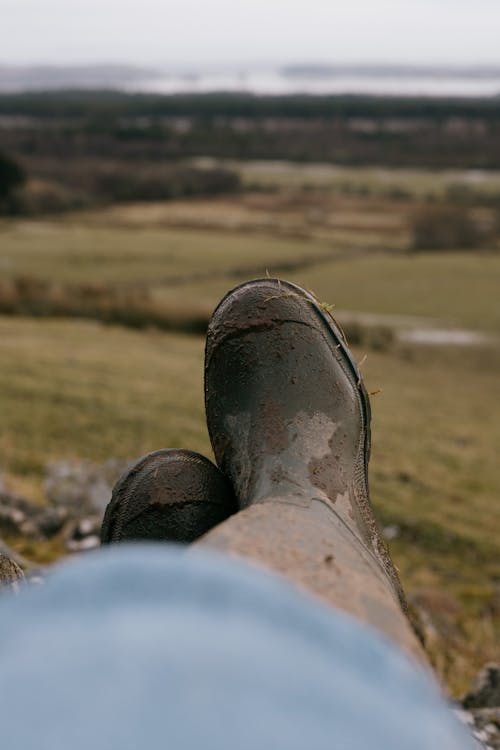 Close Up Photo of Dirty Rubber Boots