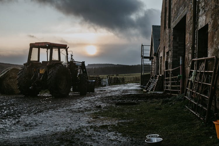 Parked Tractor On Wet And Muddy Ground