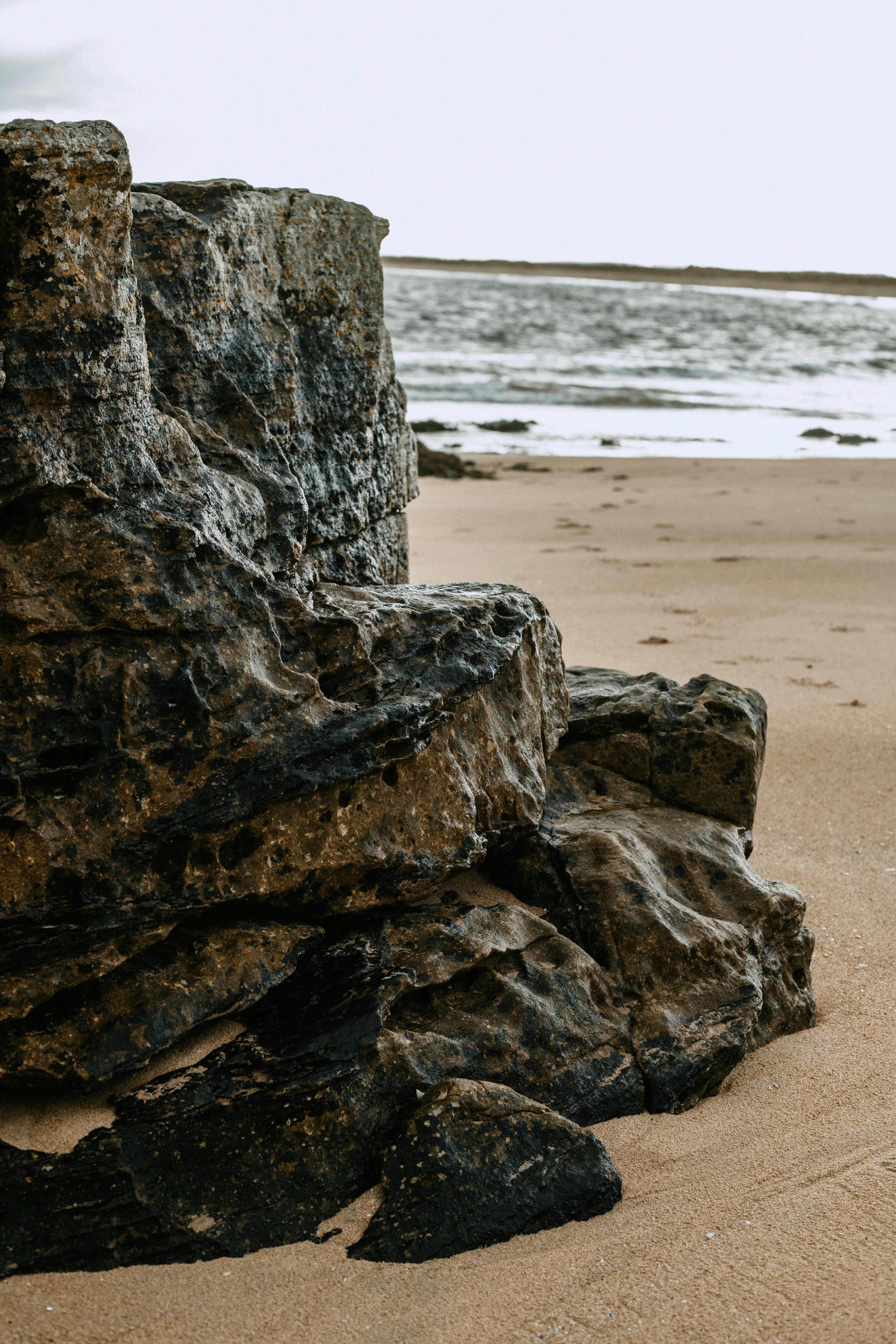 Explore the rugged coastline of Scotland with rocky formations and sandy beaches.