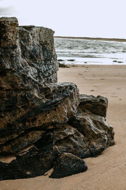 Explore the rugged coastline of Scotland with rocky formations and sandy beaches.