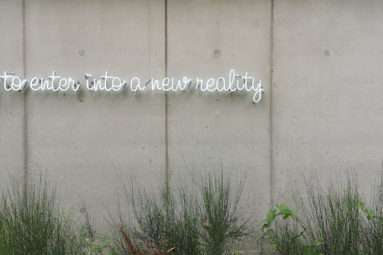 Neon Sign On A Concrete Wall