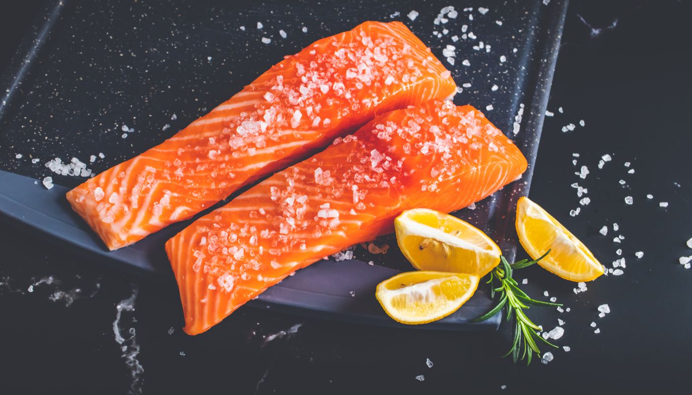 salmon burger recipe — Raw Pieces of Salmon with Salt and Lemon Wedges on a Baking Tray · Free. Photo: Pexels