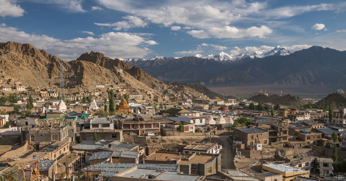 High-altitude Ladakhi valley with turquoise river and snow peaks