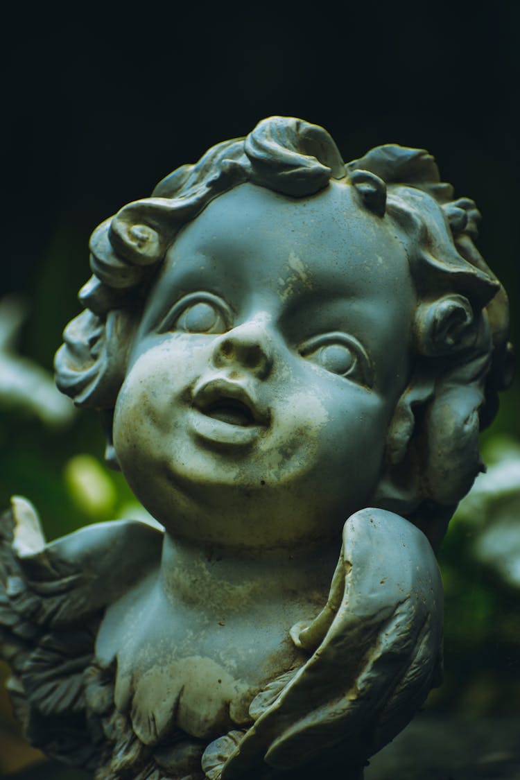 Sculpture Of Cupid Placed On Street