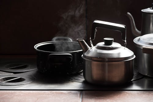 Close up of Kettle and Cooking Pot on Stove