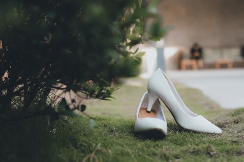 White High Heel Shoes on Grass