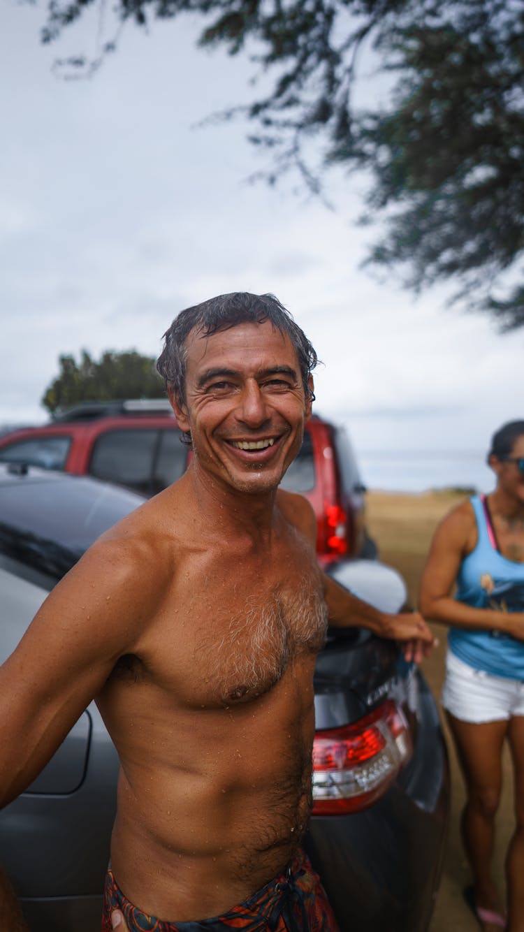 Cheerful Happy Tanned Man Near Car