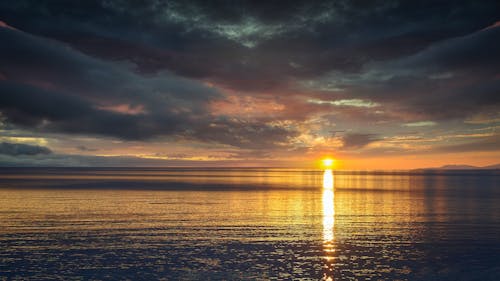 Reflection of the Sun on Water Surface during Sunset